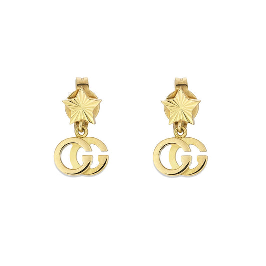 These Gucci Running G 18K yellow gold stud earrings feature gold star shapes with interlocking double G charms hanging below. Crafted by GUCCI Fine Jewellery, they are simple yet elegant, seamlessly blending geometrical and brand elements into a stylish piece that meets Responsible Jewellery Council standards.