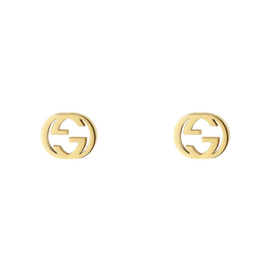 A pair of Gucci Interlocking G 18K Yellow Gold Stud Earrings, designed by GUCCI Fine Jewellery, showcases an interlocking 'G' logo against a white backdrop, crafted in adherence to certified standards from the Responsible Jewelry Council.