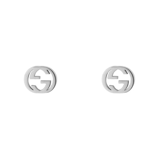 The Gucci Interlocking G 18K White Gold Stud Earrings from GUCCI Fine Jewellery showcase a sophisticated interlocking logo design on a white gold background.