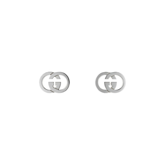The Gucci Interlocking Sterling Silver Stud Earrings by GUCCI Fine Jewellery feature interlocking double G logos and are shown on a plain white background.