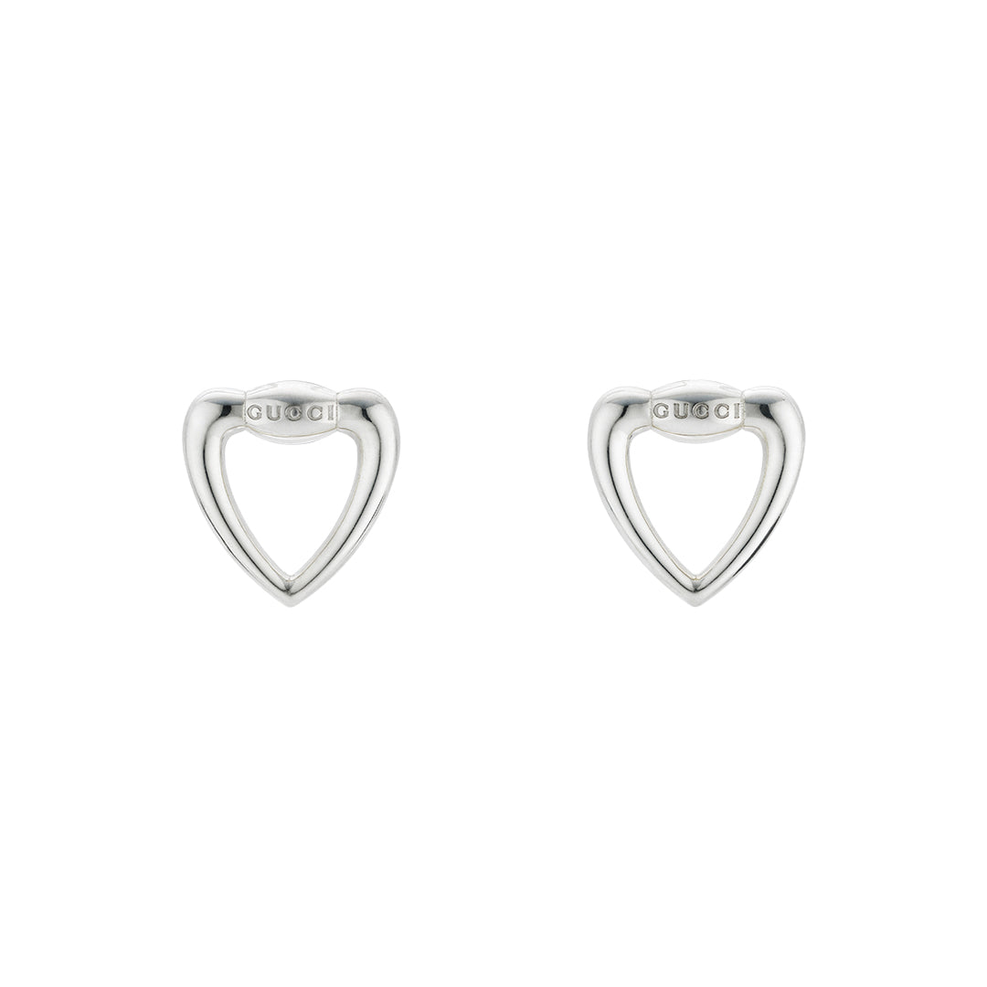 These Gucci Sterling Silver Heart Stud Earrings from GUCCI Fine Jewellery showcase a cut-out heart design with the brand name elegantly engraved, set against a pristine white background.