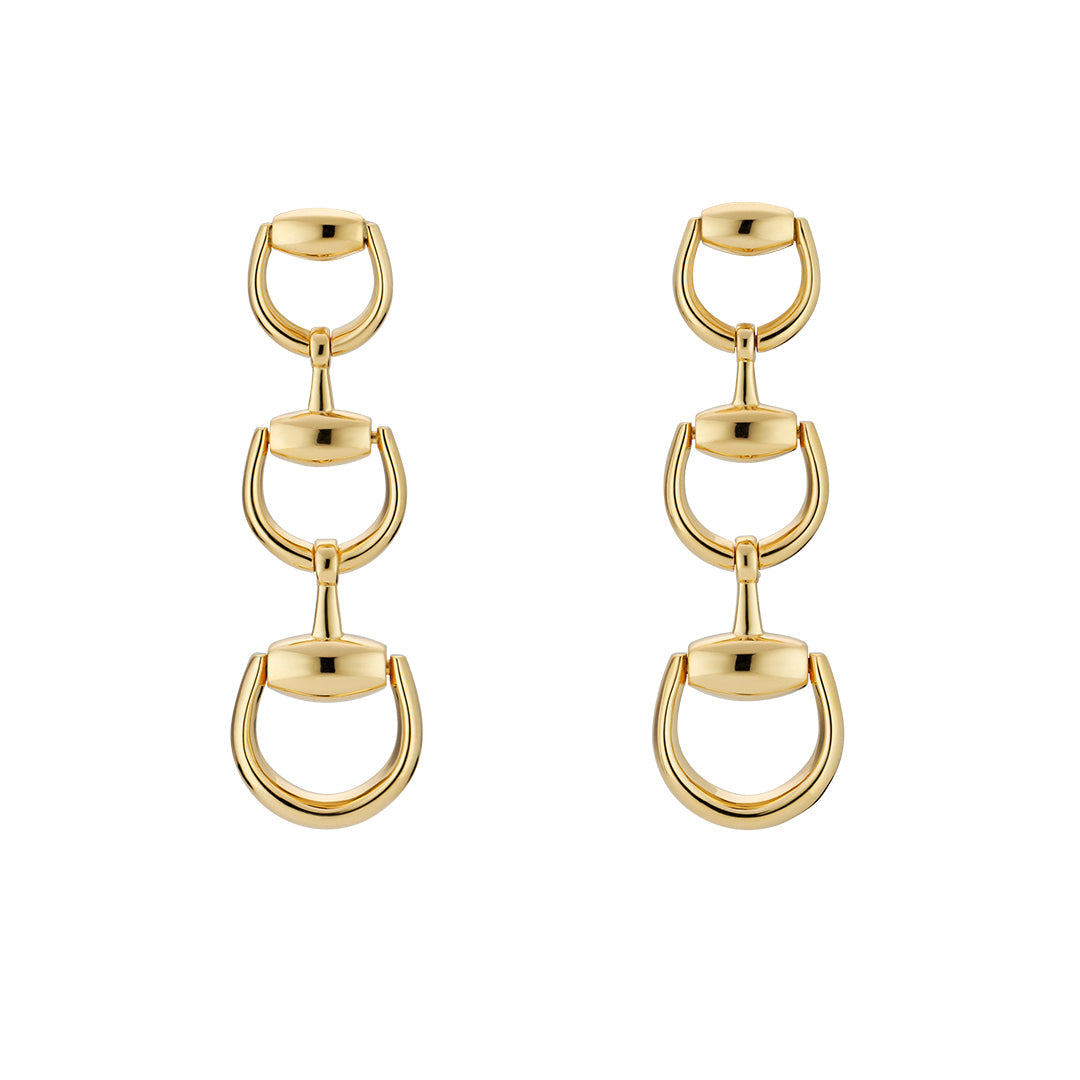 The Gucci Horsebit 18K Yellow Gold Drop Earrings by GUCCI Fine Jewellery feature three vertically linked U-shaped and oval elements, creating a modern, elegant design in fine 18k yellow gold.