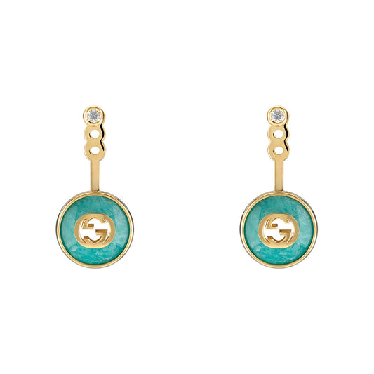The Gucci Interlocking 18K Yellow Gold Drop Earrings by GUCCI Fine Jewellery feature turquoise circular pendants with cut-out designs. Connected by a short gold bar, they include a diamond-like stud and amazonite stone, meeting Responsible Jewelry Council standards.