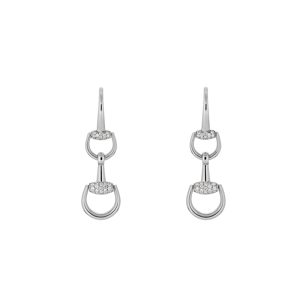 The Gucci Horsebit 18K White Gold Diamond Drop Earrings by GUCCI Fine Jewellery feature interlocking oval loops joined by pavé diamond bars, offering a sleek, modern elegance reminiscent of iconic Gucci jewelry, displayed on a plain white background.