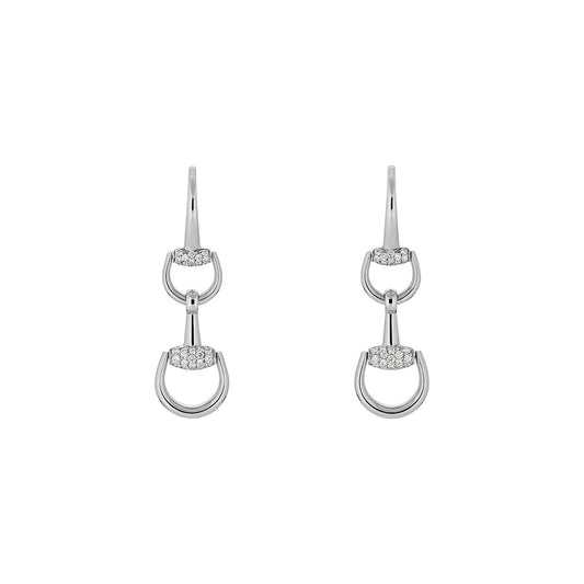 The Gucci Horsebit 18K White Gold Diamond Drop Earrings by GUCCI Fine Jewellery feature interlocking oval loops joined by pavé diamond bars, offering a sleek, modern elegance reminiscent of iconic Gucci jewelry, displayed on a plain white background.