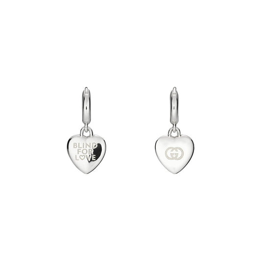 The Gucci Blind for Love Sterling Silver Hoop Earrings from GUCCI Fine Jewellery feature one hoop engraved with "BLIND FOR LOVE" and the other with an interlocking double G logo, adding a chic romantic touch to any look.
