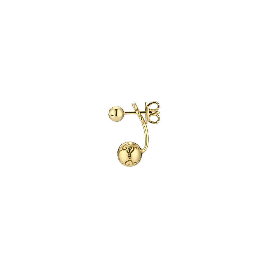 The Gucci Icon Boule 18K Yellow Gold Jacket Earring by GUCCI Fine Jewellery features a small front stud, a curved bar, and a larger engraved gold boule at the back for a unique decorative touch.