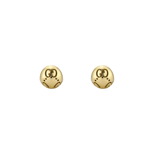 A pair of Gucci Icon Boule 18K yellow gold stud earrings by GUCCI Fine Jewellery, featuring small skull shapes with interlocking double G logos on the forehead, 12 mm open size, shown on a plain white background.
