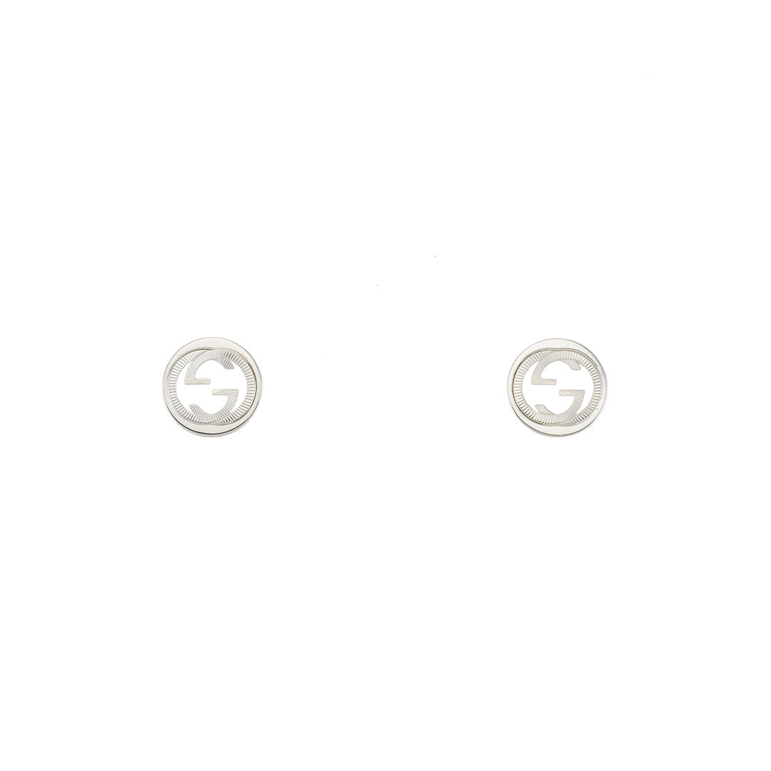 A pair of Gucci Interlocking G Sterling Silver Stud Earrings by GUCCI Fine Jewellery, featuring a Guilloché cut-out double G logo design, displayed on a white background.