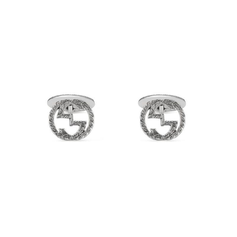 The Gucci Interlocking G Cufflinks from GUCCI Fine Jewellery showcase a round design with intertwined double G letters. Made from 925 sterling silver, they feature intricate detailing that creates a textured finish, offering a stylish yet subtle enhancement to formal attire.