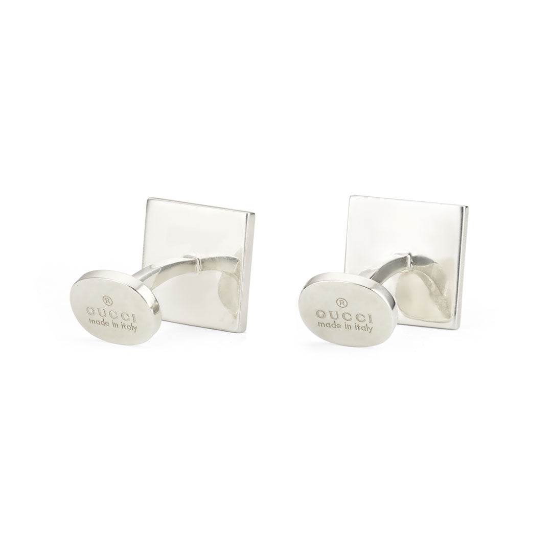 A pair of Gucci Diamante Sterling Silver Cufflinks by GUCCI Gift and Accessories, crafted from 925 sterling silver with square backs and round faces engraved with "Gucci made in Italy," displayed on a white background.
