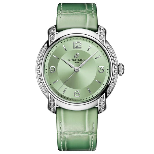 The BREITLING Lady Premier Automatic 36 is a luxury watch featuring a light green leather strap, green dial, silver accents, diamond-set bezel, silver hour markers and hands, plus the “Breitling 1884” logo at the top.