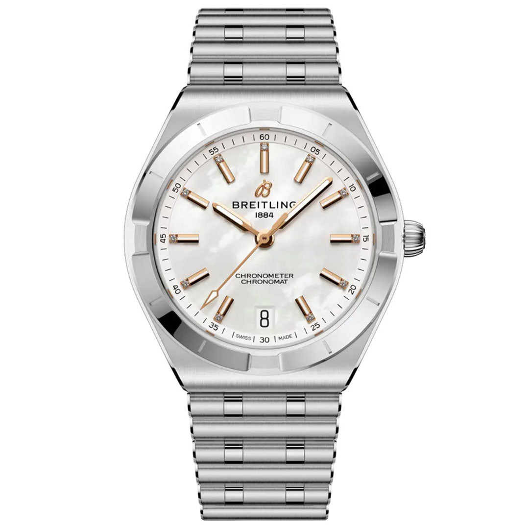 The BREITLING Chronomat Automatic 36 is a stainless steel sports watch with a silver metal band, COSC-certified movement, white mother-of-pearl dial, gold markers and hands, date at 6 o’clock, and the Breitling logo below 12.