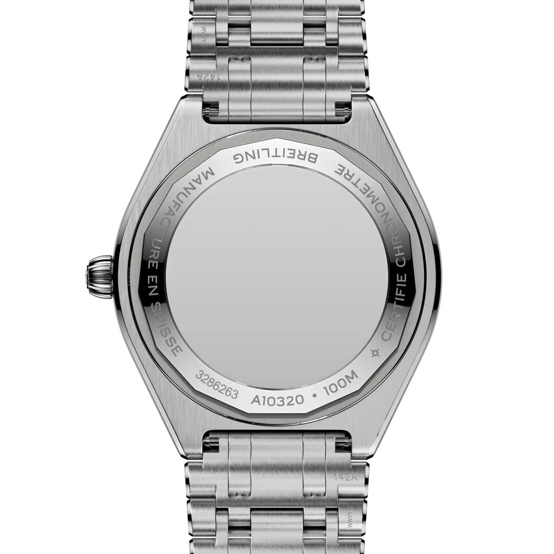 The image shows the back of a silver Breitling Chronomat Automatic 36 watch with a metal bracelet, engraved with "MANUFACTURE BREITLING," "CERTIFIE CHRONOMETRE," "100M," and serial numbers.