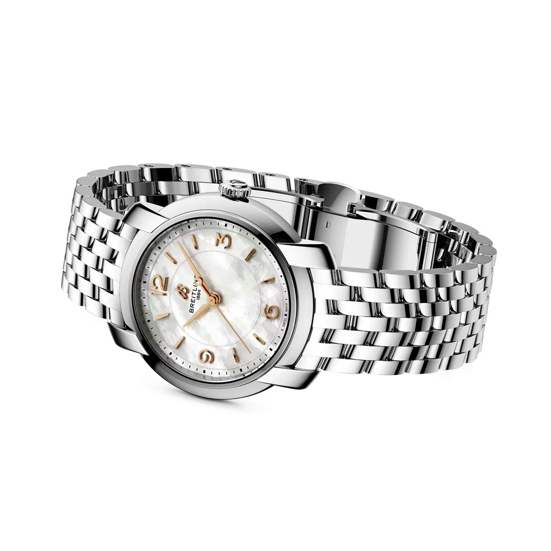 The BREITLING Lady Premier 32 by Breitling is a silver stainless steel women’s luxury watch with a white mother-of-pearl dial, gold hour markers, and a date window, shown angled on a white background.