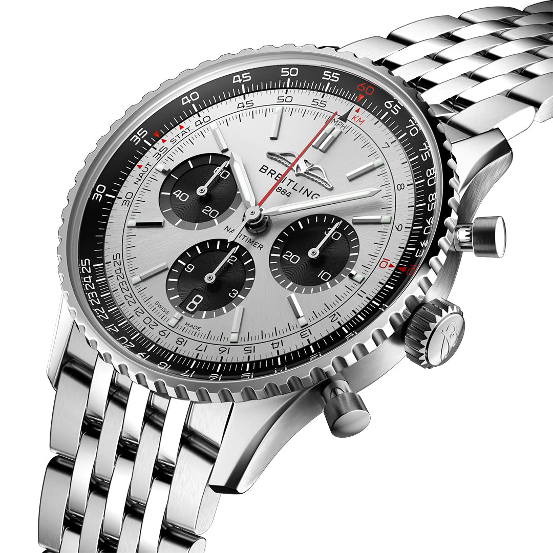 The BREITLING Navitimer B01 Chronograph 43 is a luxury timepiece featuring a silver stainless steel bracelet, a white dial, three black subdials, and a rotating bezel with red and black markings. Its polished silver hands and hour markers enhance its sophisticated design.