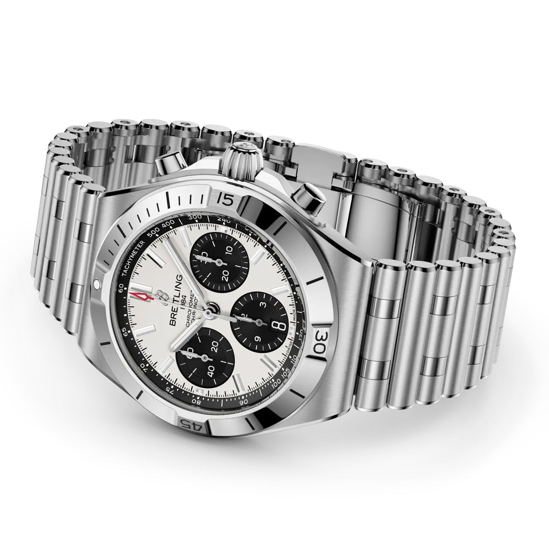 The BREITLING Chronomat B01 Chronograph 42 by Breitling features a stainless steel case, silver bracelet, white dial with three black sub-dials, and a tachymeter bezel, shown at an angle on a white background.