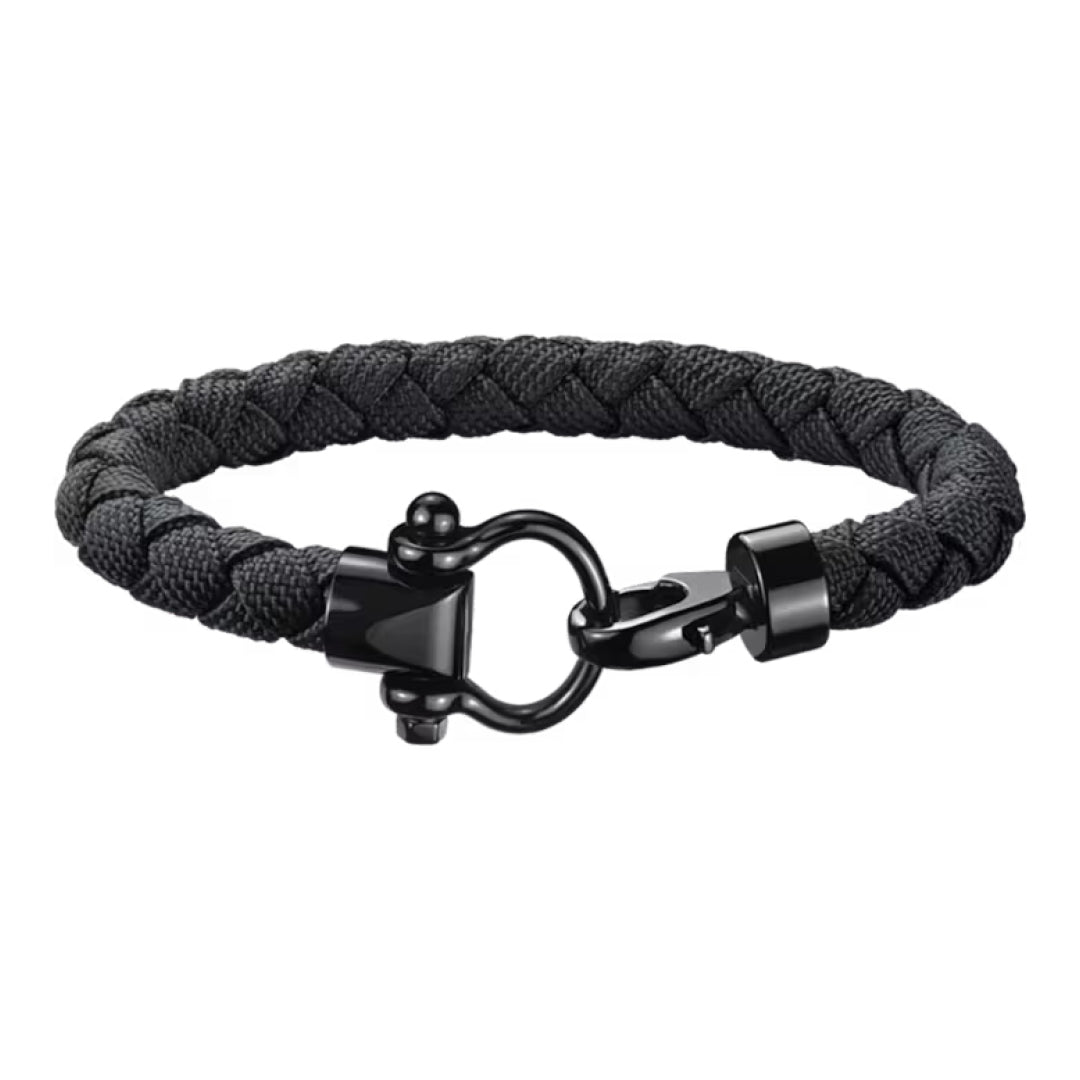 The OMEGA Aqua Sailing Nylon Bracelet by OMEGA features a black braided nylon rope with a shiny black stainless steel clasp and hardware, shown on a white background.