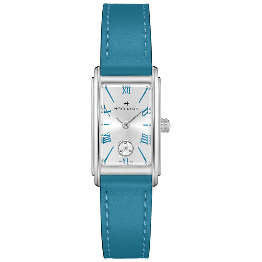 The Hamilton American Classic Ardmore Quartz 18.7mm X 27mm Watch by Hamilton Watch features a rectangular silver case with a white dial and teal Roman numerals, exuding a touch of Art Deco elegance. It includes a subsidiary seconds dial at the 6 o'clock position and is paired with a turquoise leather strap and a sleek silver crown on the side.