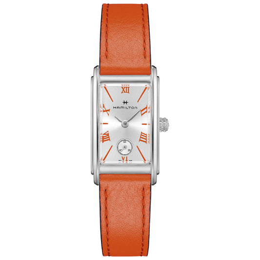 The Hamilton American Classic Ardmore Quartz 18.7mm X 27mm Watch from Hamilton Watch exudes a timeless American Classic elegance. It features a rectangular case with a refined silver finish and is complemented by a stylish coral leather strap. The dial stands out with orange Roman numerals and slim hands, along with the added functionality of a small subdial. Its polished border elegantly combines classic charm and modern design, reminiscent of Art Deco sophistication.