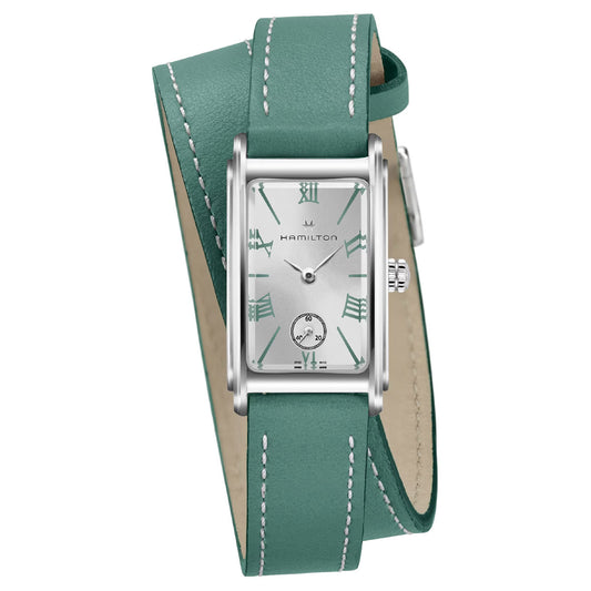 The Hamilton American Classic Ardmore Quartz 18.7mm X 27mm Watch showcases a rectangular silver face with green Roman numerals, complemented by a small subdial and an Art Deco revival inspired double-wrap green leather strap with white stitching, beautifully capturing the essence of the American Classic style.