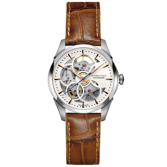 The Hamilton Jazzmaster Skeleton Lady Auto 36mm Watch by Hamilton Watch features a stylish brown leather strap and an elaborately skeletonized dial that reveals its gears and inner workings. With a silver bezel and exquisite detailing, it beautifully combines modern and classic design elements, ensuring precise timekeeping through its H-20-S movement.