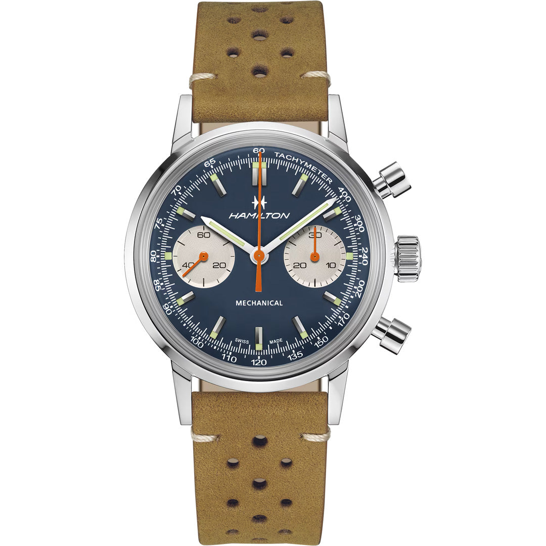 The Hamilton American Classic Intra-Matic Mechanical Chronograph H 40mm Watch features a blue dial with two subdials, bold orange hands, white tachymeter markings, a silver case, and a brown perforated leather strap.