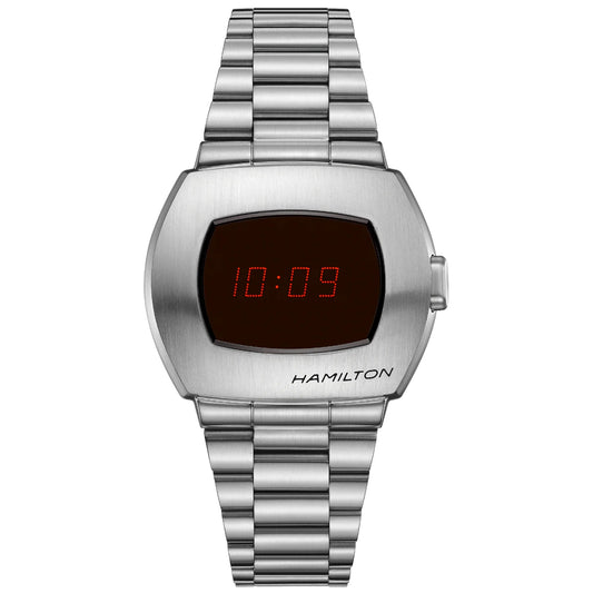 The Hamilton American Classic PSR Digital Quartz 40.8mm X 34.7mm Watch boasts a sleek, minimalist design with a stainless steel case and metallic strap. Its face prominently displays the red numbers "10:09," while the brand name "Hamilton Watch" is subtly positioned at the lower right.