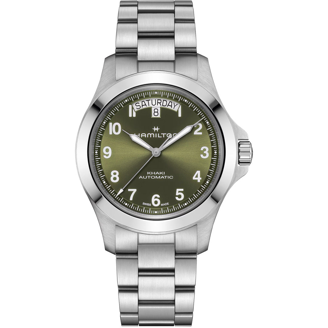 The Hamilton Khaki Field King Auto 40mm Watch by Hamilton Watch features a stainless steel case, olive green dial, silver markers and hands, day/date at 12 o'clock, and a metal link bracelet.