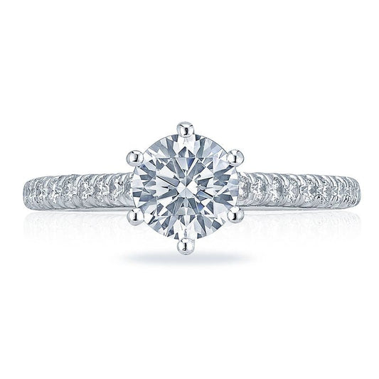 Introducing the Tacori Petite Crescent 18K White Gold Round Brilliant Solitaire Semi Mount with Diamond Band Engagement Ring. This elegant piece showcases a dazzling round-cut diamond in a classic six-prong setting, accented by smaller diamonds on the band. Crafted by expert Tacori gemologists, it offers unparalleled sparkle and sophistication for those seeking an exquisite engagement ring.