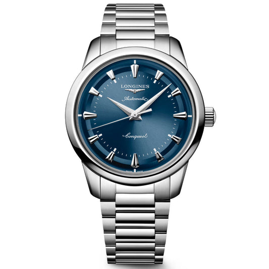 The Longines Conquest Heritage Automatic 40mm Watch features a stainless steel case, metallic blue dial, silver hour markers, and a link bracelet—showcasing classic vintage design with modern watchmaking by Longines.
