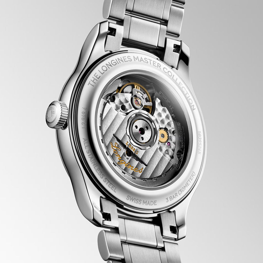Close-up of the back of the Longines Master Collection Automatic 39mm Watch by Longines, highlighting exquisite Swiss craftsmanship with a visible automatic movement and intricate engravings on its stainless steel case and bracelet.