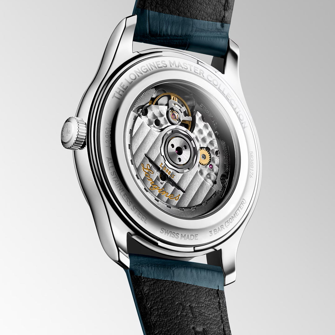 A rear view of the Longines Master Collection Automatic 41mm Watch displays its transparent case back, revealing the intricate Swiss-made gears and bearing the “The Longines Master Collection” inscription. The timepiece features a black leather strap by Longines.
