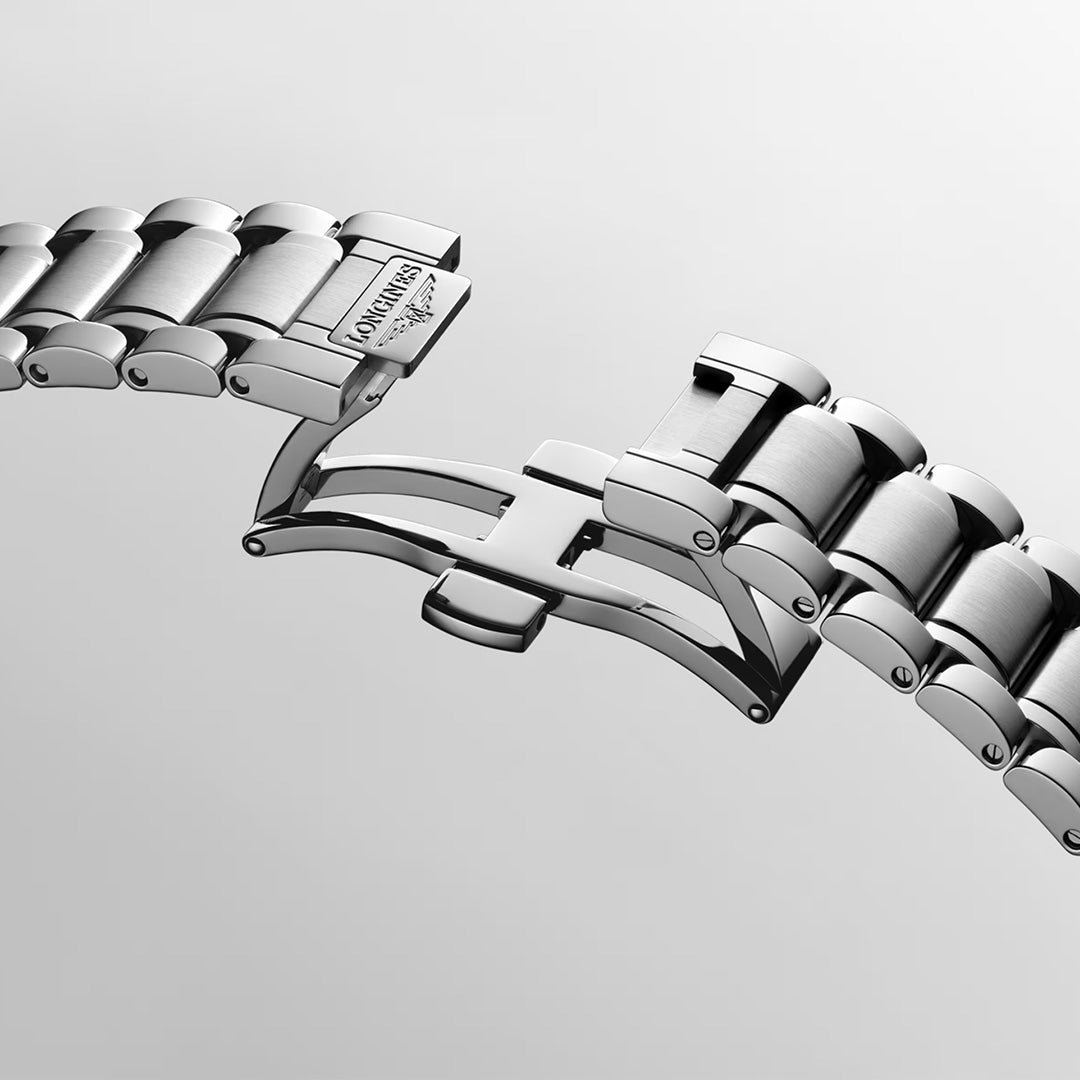 A close-up of a stainless steel bracelet with a partially open folding clasp, featuring the engraved “Longines” logo, set against a plain light background—an elegant detail that exemplifies the Longines Master Collection Automatic 41mm Watch and its enduring tradition of luxury watchmaking.
