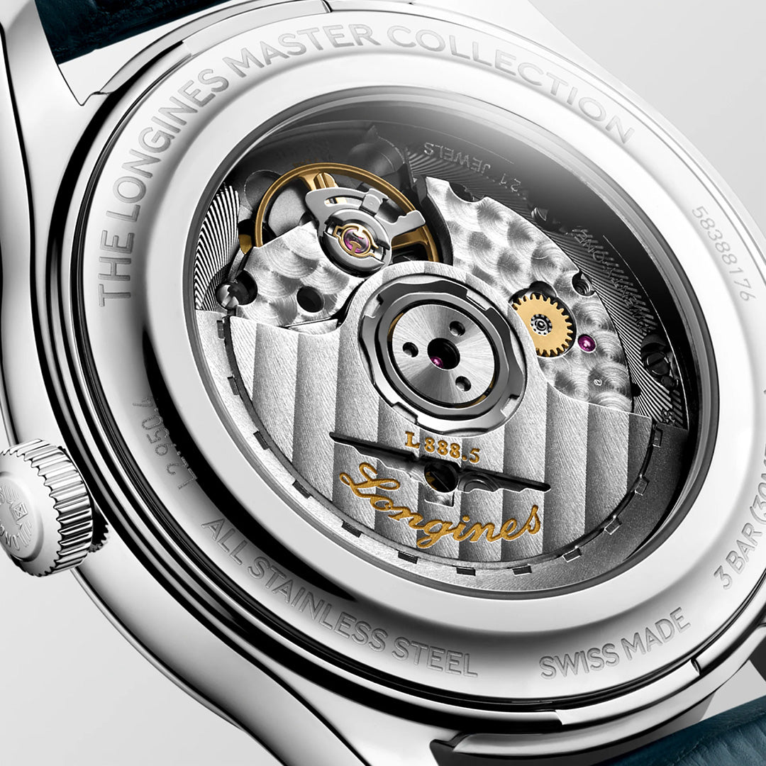 Close-up of the back of the Longines Master Collection Automatic 41mm Watch by Longines, highlighting the exceptional horological craftsmanship behind this luxury timepiece. The image showcases the intricate automatic movement, engraved rotor, and fine details such as “ALL STAINLESS STEEL” and “SWISS MADE” on the case.