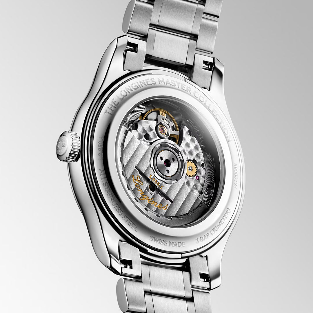 Close-up of the back of the Longines Master Collection Automatic 41mm Watch by Longines, highlighting the exposed automatic movement and finely engraved details on the silver metal case and bracelet—a true display of horological craftsmanship.