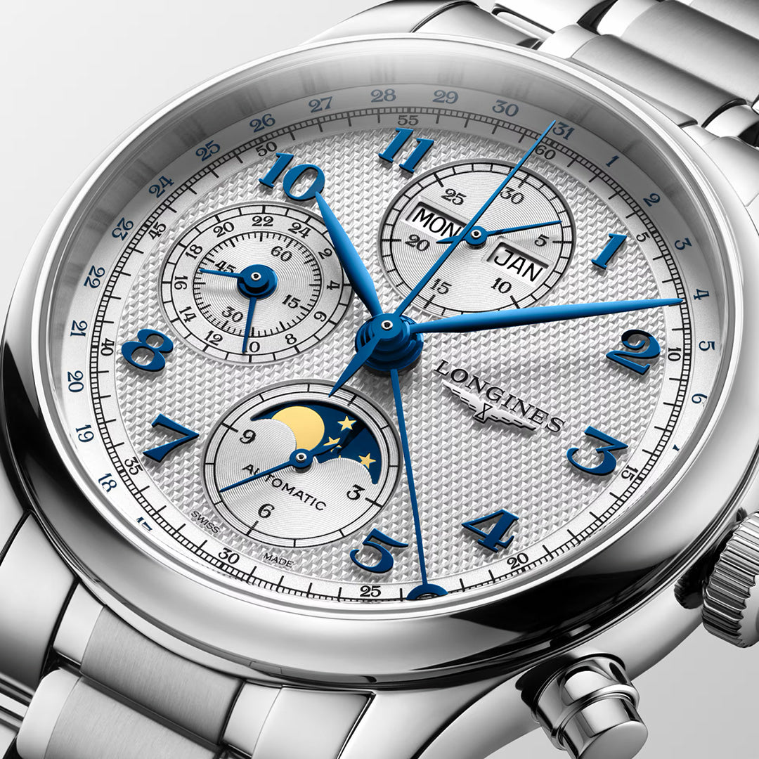 Longines Master Collection Chrono Moonphase Automatic 41mm Watch with a silver case, textured white dial, blue Arabic numerals, blue hands, a moon phase display at six o’clock, and day and month windows at twelve o’clock.