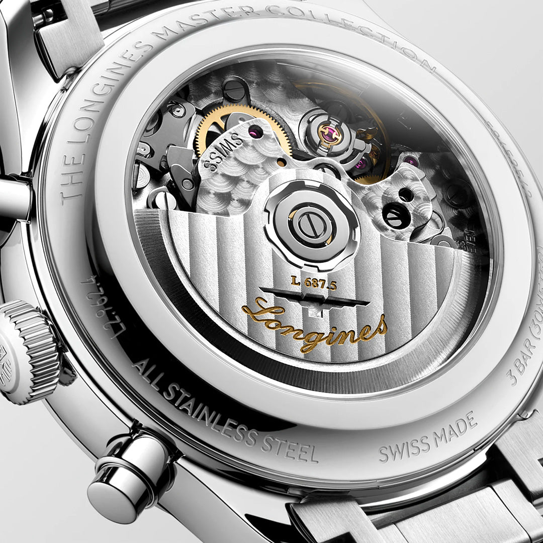 Close-up of the open-case back of a Longines Master Collection Chrono Moonphase Automatic 41mm Watch, featuring an engraved rotor with vertical stripes and a visible balance wheel.