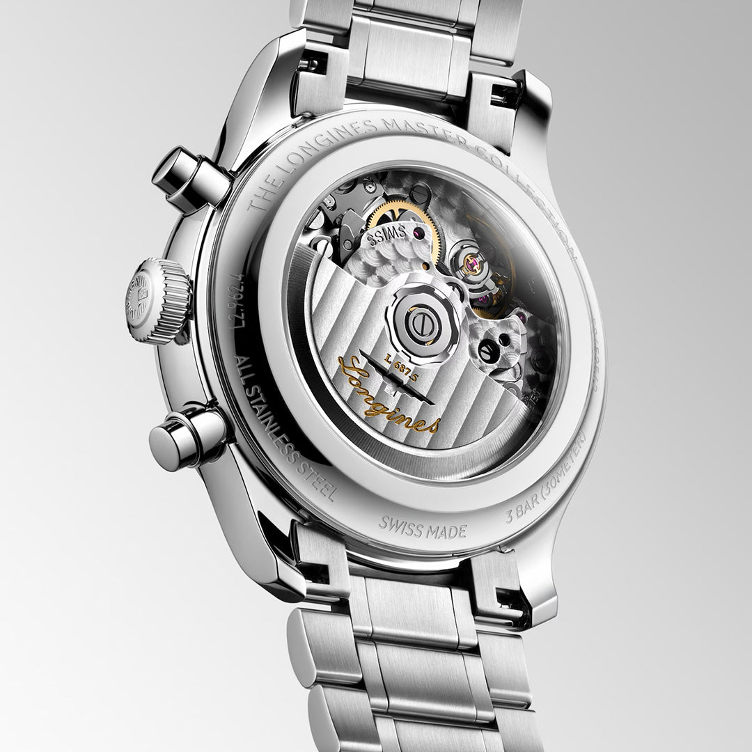 The transparent case back of a stainless steel Longines Master Collection Chrono Moonphase Automatic 41mm Watch, revealing the internal mechanical movement with a signed oscillating weight.