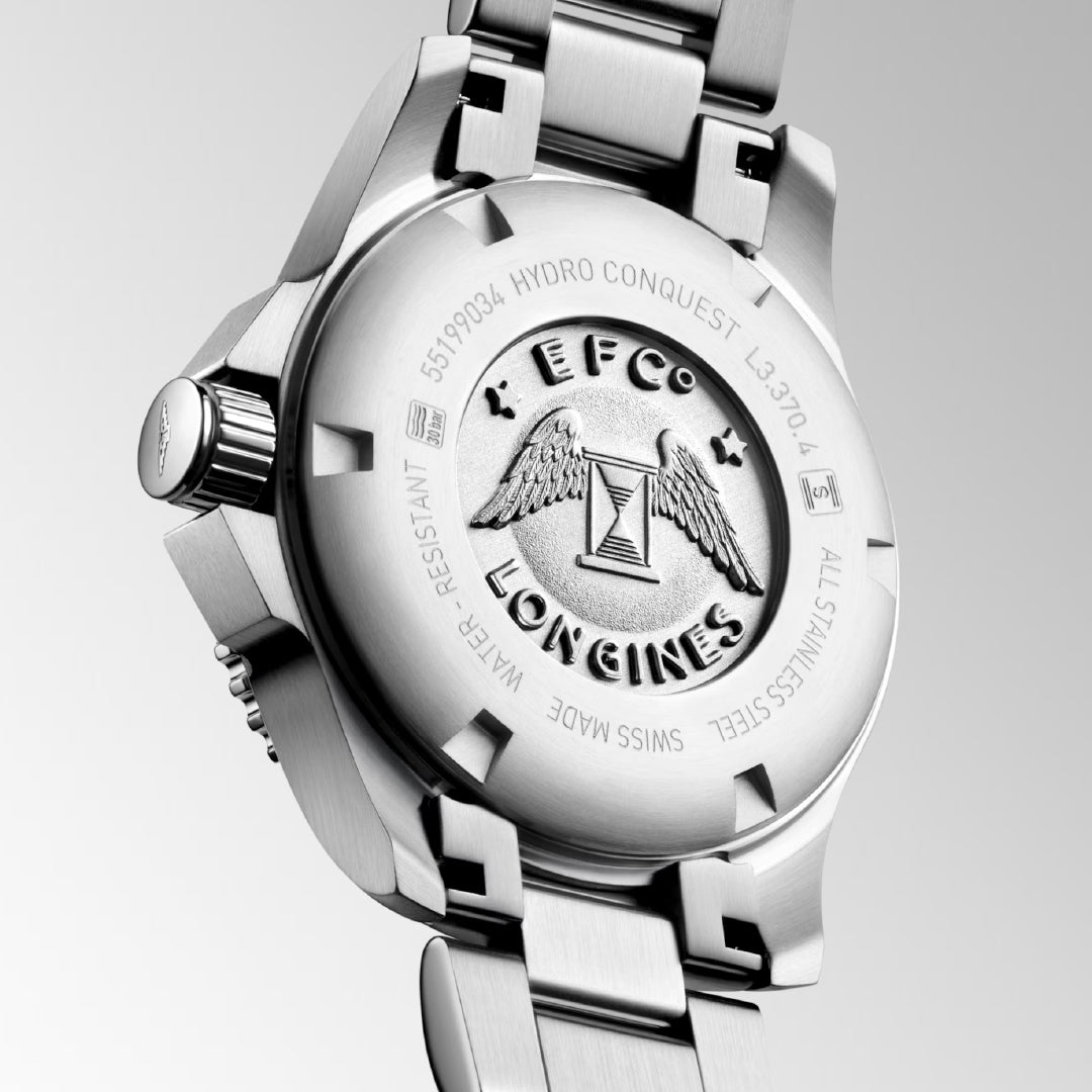 Close-up of the Longines HydroConquest Quartz 32mm watch back showcases the embossed wings-and-hourglass logo with "EFCo" and "HYDRO CONQUEST." Ideal for water sports, it features a stainless steel bracelet, crown, and unidirectional rotating bezel.