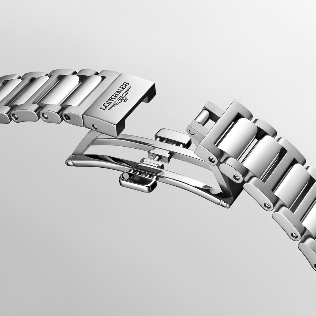 Close-up image of a stainless steel bracelet for the Longines Conquest Automatic 34mm Watch, featuring a partially open butterfly clasp. The renowned brand name "Longines" is engraved on the clasp, highlighting its horological excellence against a smooth, light gray gradient background.