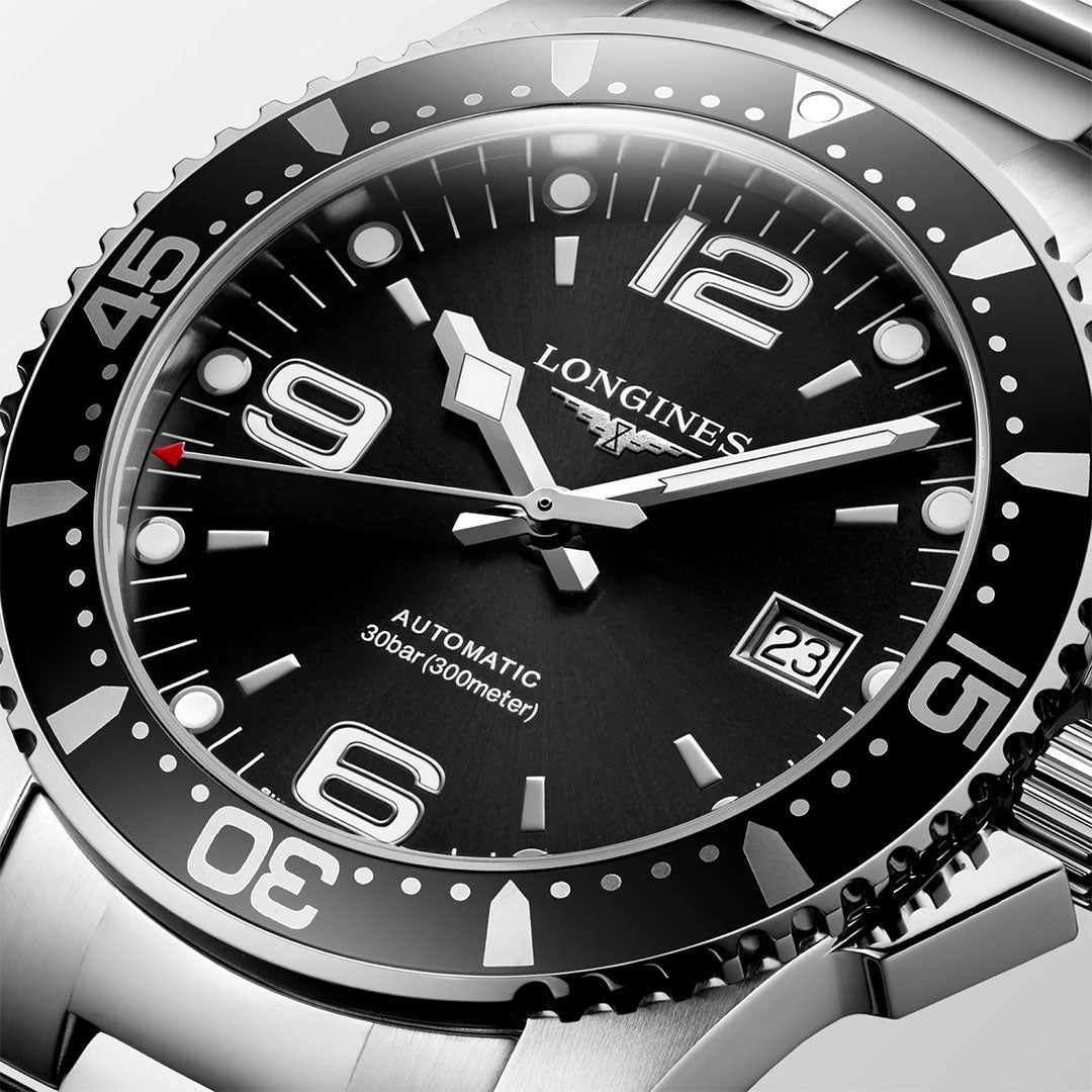 Close-up of the Longines Hydroconquest Automatic 41mm watch, showcasing a black dial with bold white numerals, luminous hands, date at 3 o'clock, unidirectional bezel, and stainless steel case and bracelet by Longines.