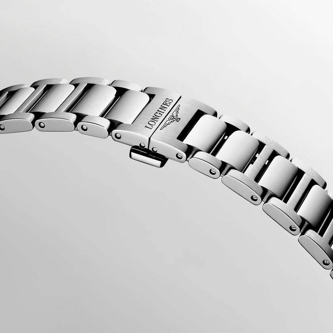 Close-up of a stainless steel Longines Conquest Quartz 38mm Watch bracelet featuring a folding clasp with an engraved brand name and logo.