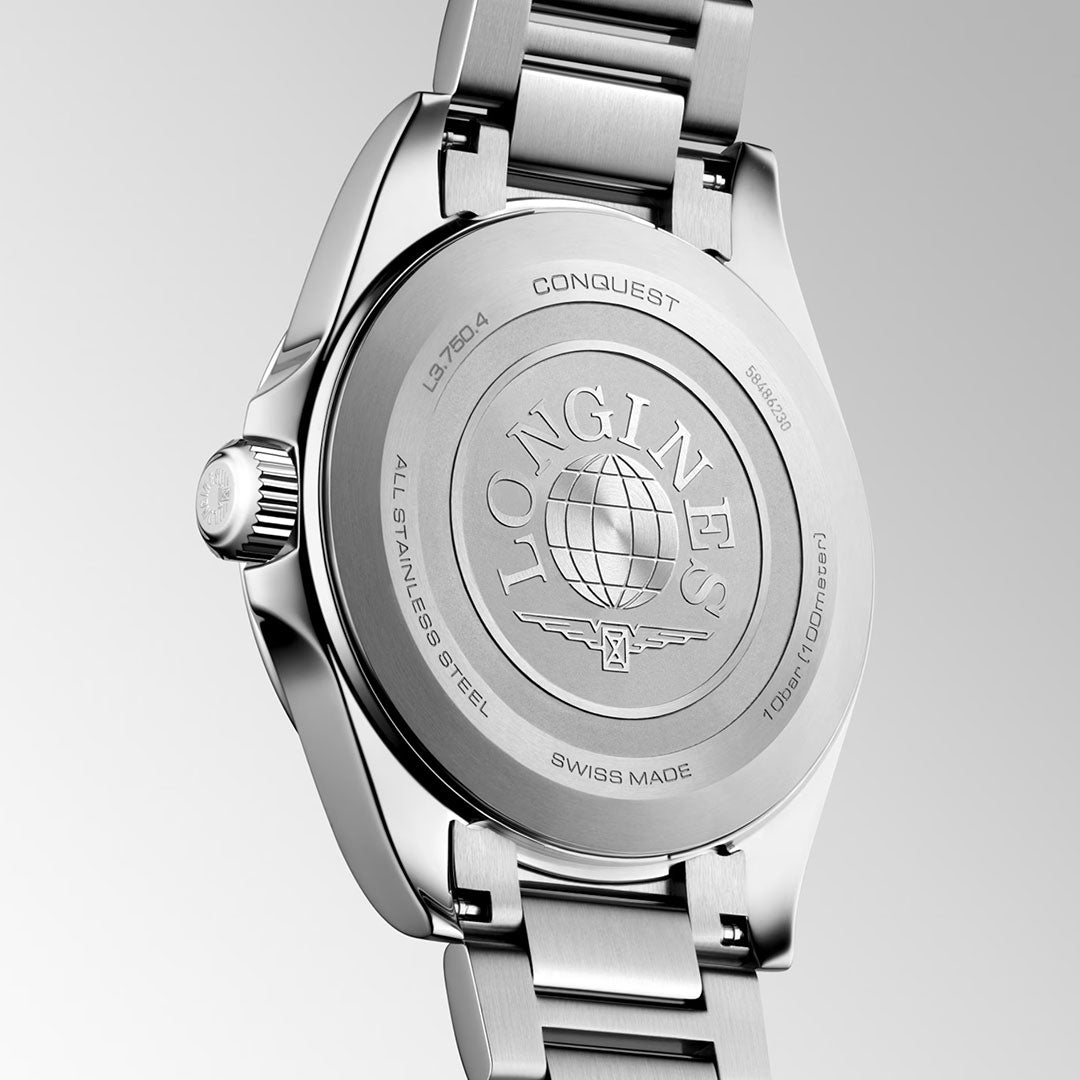 Close-up of the stainless steel back of the Longines Conquest Quartz 38mm Watch by Longines, displaying engraved branding, a globe emblem, and product details against a light gradient background.