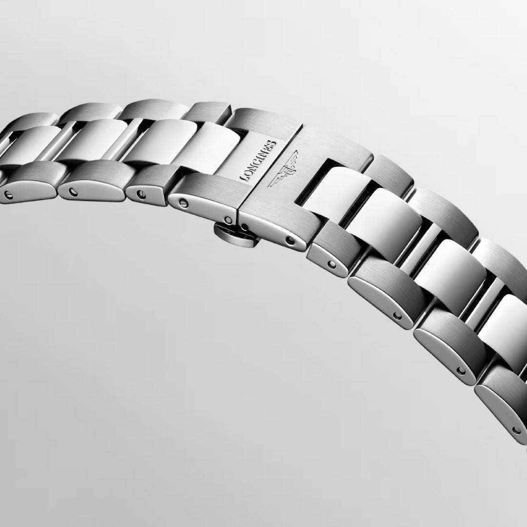 Close-up of the Longines Conquest Quartz 43mm Watch’s stainless steel bracelet with polished and brushed finishes, displaying the Longines logo and winged hourglass on the clasp—an elegant, everyday timepiece.