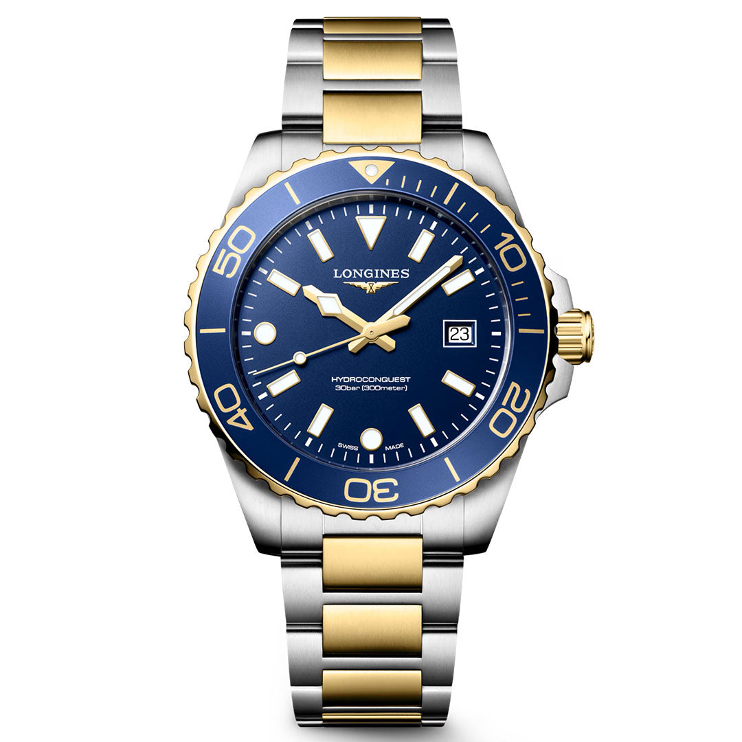 This Longines HydroConquest Quartz 42mm Watch features a stainless steel and gold case with a striking blue bezel and dial, complemented by gold accents. It includes a date display at the 3 o'clock position and is fitted with a silver-and-gold metal link bracelet. Exemplifying Swiss precision and the dynamic spirit of modern sport watches, this stylish timepiece by Longines displays the time at 10:10.