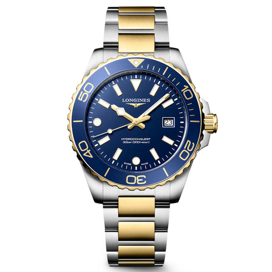 This Longines HydroConquest Quartz 42mm Watch features a stainless steel and gold case with a striking blue bezel and dial, complemented by gold accents. It includes a date display at the 3 o'clock position and is fitted with a silver-and-gold metal link bracelet. Exemplifying Swiss precision and the dynamic spirit of modern sport watches, this stylish timepiece by Longines displays the time at 10:10.