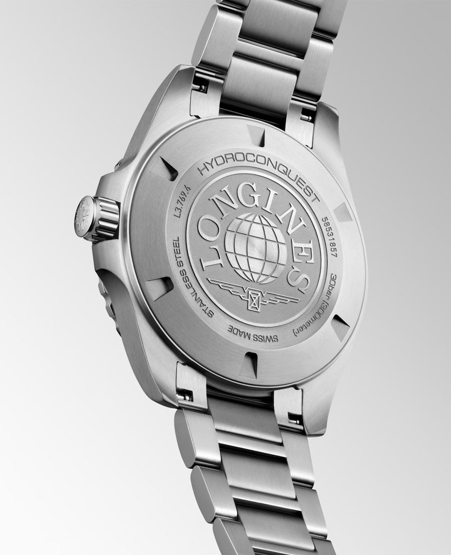 Close-up of the back of a Longines HydroConquest Quartz 42mm Watch, featuring engraved Longines branding, a serial number, and a globe motif on the case back—a testament to exceptional craftsmanship in Swiss sport watches.