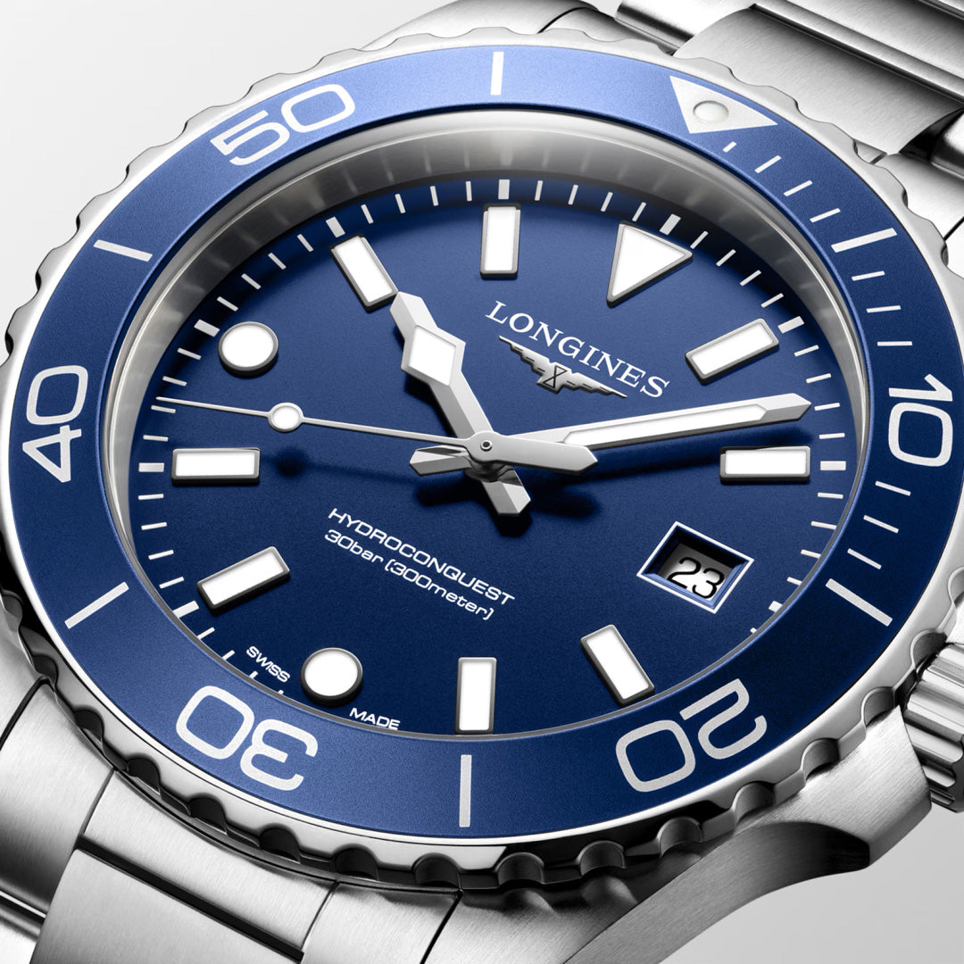 Close-up of the Longines HydroConquest Quartz 42mm Watch by Longines, featuring a blue dial, stainless steel band, white markers, a date window at 3 o’clock, and “300 meters” water resistance on the dial—a striking showcase of precision Swiss watch craftsmanship in sports timepieces.