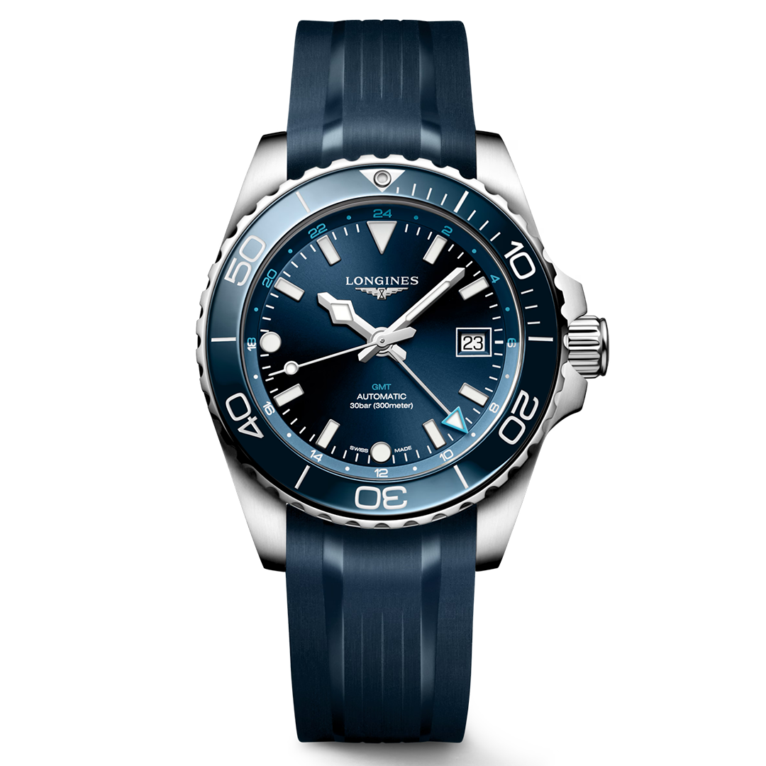 A standout in the Longines Sport Collection, the Longines HydroConquest GMT Automatic 41mm Watch features a blue rubber strap, a matching blue bezel and dial, white hour markers with Swiss Super-LumiNova for superior visibility, a date window at 3 o’clock, and the inscription “GMT AUTOMATIC 300m/1000ft” on its face.